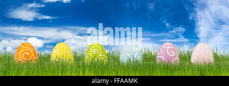 colorful decorated easter eggs on green grass Stock Photo