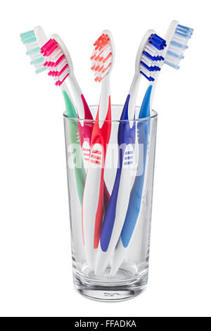 glass with colorful tooth brushes isolated on white background Stock Photo