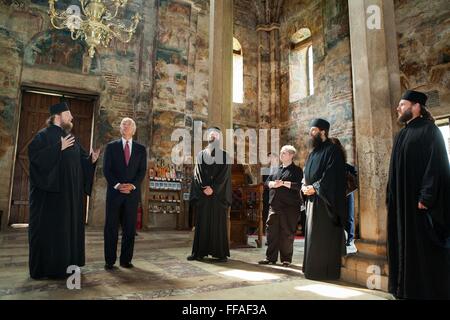 U.S Vice President Joe Biden tours the Decani Monastery with Serbian Orthodox Monk Father Sava, left, during a visit May 21, 2009 in Decani, Kosovo. The Serbian Orthodox Monastery was established in 1327, and the paintings on the walls date to 1350. Stock Photo