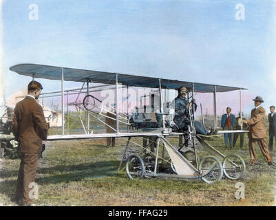 ORVILLE WRIGHT (1871-1948). /nAmerican aviation pioneer. Posing at the controls of the 'Baby Grand,' the Wright entry in the Gordon Bennett races at Belmont Park, New York, October 1910. Oil over a photograph. Stock Photo