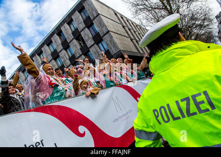 Police operation during street carnival in Cologne, Germany, during Rose Monday parade, police officers at duty in the city, Stock Photo