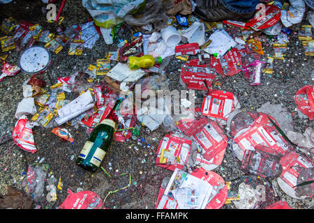 Street carnival parade and party in Cologne, Germany, at Carnival Monday, Shrove Monday, Rose Monday, remains, rubbish on street Stock Photo