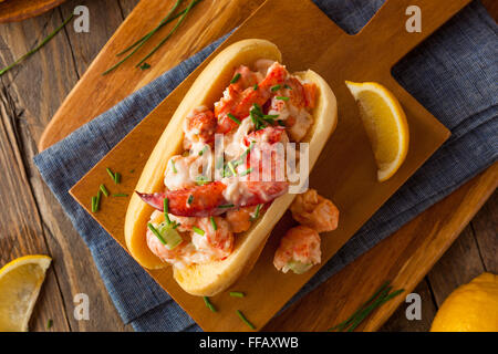 Homemade New England Lobster Roll with Lemons Stock Photo