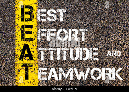 Concept image of Business Acronym BEAT Best Effort, Attitude, and Teamwork written over road marking yellow paint line Stock Photo