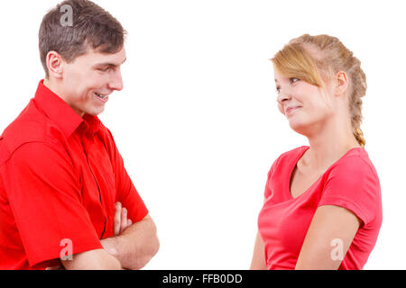 Woman and man contacts with each other. Man talks flirty. Isolated on white. Stock Photo