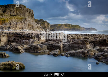 the beach and cliffs at bracelet bay, wales Stock Photo