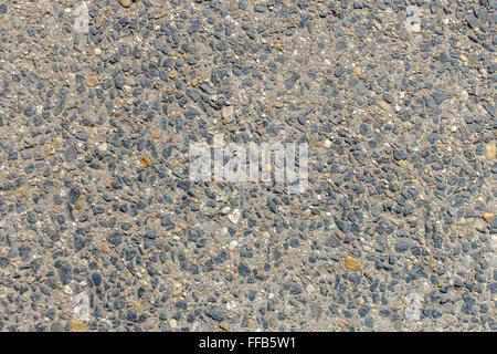 Texture of an outdoor stone floow made of many small stones in concrete. Stock Photo
