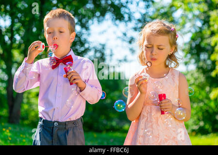 Portrait child with soap bubbles on a summer day Stock Photo