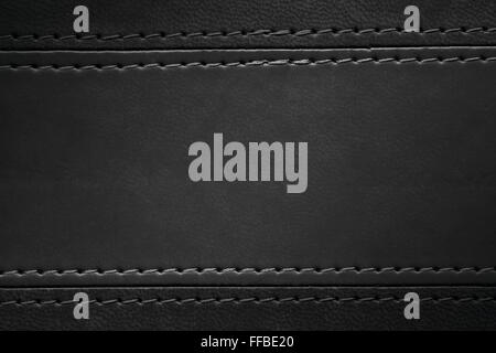 black leather texture with seam at margins Stock Photo
