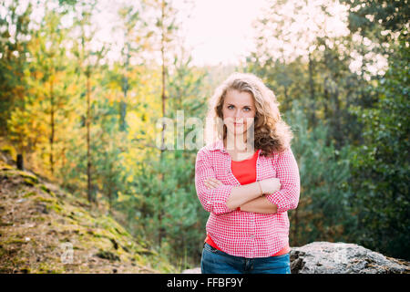 Beautiful Plus Size Young Smiling Woman In Shirt Posing In Summer Forest. Stock Photo