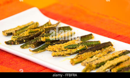 Bhendi fodi is a crunchy, crispy and very delicious stir fry dish and this can be served as an appetizer, evening, snack or with Stock Photo