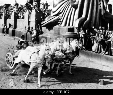 BEN-HUR, 1959. /nCharlton Heston in the title role driving white steeds ...