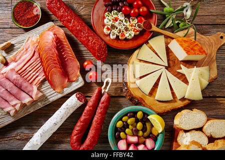 Tapas sausage mix from Spain jamon iberico lomo cheese ham chorizo olives Stock Photo