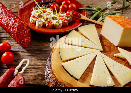 Tapas sausage mix from Spain jamon iberico lomo cheese ham chorizo olives Stock Photo