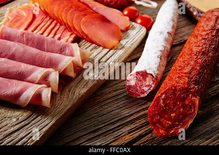 Tapas sausage mix from Spain jamon iberico lomo cheese ham chorizo olives Stock Photo