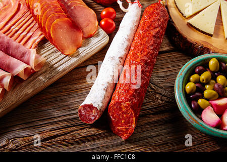 Tapas sausage mix from Spain jamon iberico lomo cheese ham chorizo olives Stock Photo