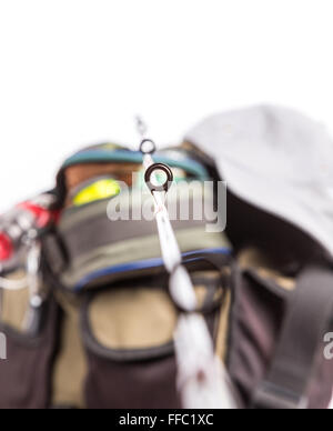 selective focus the guide ring on rod with background from fishing tackles in handbag Stock Photo