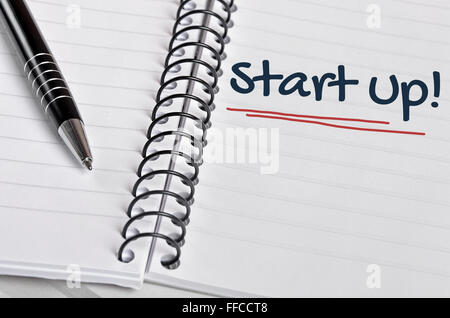 Start up word written on notebook page Stock Photo