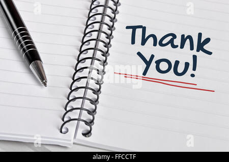 Thank you word written on  notebook page Stock Photo