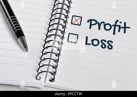 Profit box checked on notebook page Stock Photo