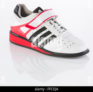 Adidas Olympic weightlifting shoes on a white background with a reflection. Stock Photo