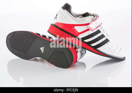 Adidas Olympic weightlifting shoes on a white background with a reflection. Stock Photo