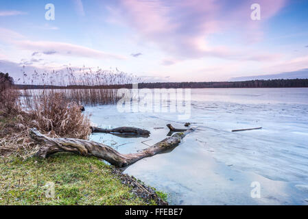 A sunset over icy lake Stock Photo