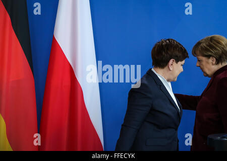 Berlin, Germany. 12th Feb, 2016. German Chancellor Angela Merkel (R) and visiting Polish Prime Minister Beata Szydlo attend a press conference at the Chancellery in Berlin, Germany, on Feb. 12, 2016. © Zhang Fan/Xinhua/Alamy Live News Stock Photo