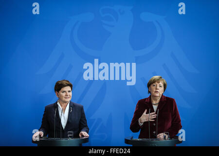 Berlin, Germany. 12th Feb, 2016. German Chancellor Angela Merkel (R) and visiting Polish Prime Minister Beata Szydlo attend a press conference at the Chancellery in Berlin, Germany, on Feb. 12, 2016. © Zhang Fan/Xinhua/Alamy Live News Stock Photo