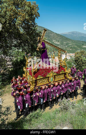 Semana Santa (Easter or Holy Week) procession. Villagers carrying Christ bearing the cross to Calvary (Ermita Calvario). Carcabuey, Cordoba. Spain Stock Photo