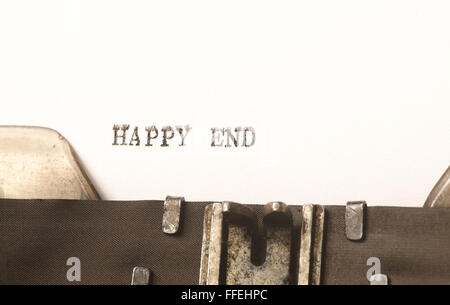 words happy end  written on old typewriter Stock Photo