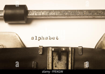 word alphabet written on old typewriter Stock Photo