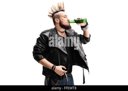 Studio shot of a young male punk rocker holding a cigarette and drinking a beer isolated on white background Stock Photo