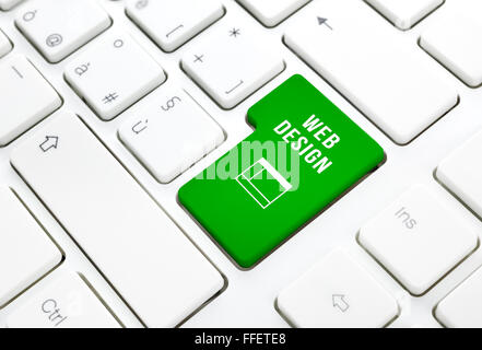 Web Design business concept, green enter button or key on white keyboard photography. Stock Photo