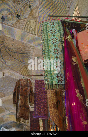 Vakil Bazaar, cloths on display an domed roof, Shiraz, Iran Stock Photo