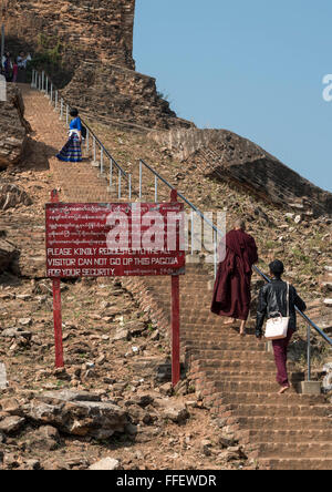 People climb Mingun Pagoda (Pahtodawgyi) despite warning sign, Burma (Myanmar) Stock Photo