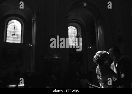 bride and groom illuminated by light Stock Photo