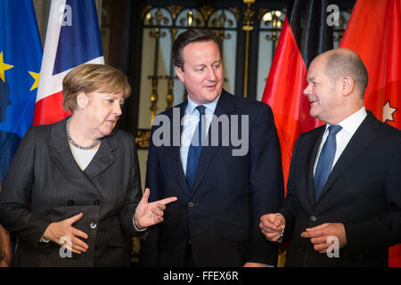 Hamburg, Germany. 12th Feb, 2016. Chancellor Angela Merkel (CDU, l), British Premier David Cameron (c) and Mayor of Hamburg Olaf Scholz (SPD, r) together at the city hall of Hamburg, Germany, 12 February 2016. Merkel and Cameron are guests of honour at the oldest feast in the world. Since 1356, the governance of the Hanse city invites to the Matthiae dinner. PHOTO: CHRISTIAN CHARISIUS/dpa/Alamy Live News Stock Photo