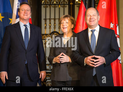 Hamburg, Germany. 12th Feb, 2016. British Premier David Cameron (l-r), Chancellor Angela Merkel (CDU) and Mayor of Hamburg Olaf Scholz (SPD) together at the city hall of Hamburg, Germany, 12 February 2016. Merkel and Cameron are guests of honour at the oldest feast in the world. Since 1356, the governance of the Hanse city invites to the Matthiae dinner. PHOTO: CHRISTIAN CHARISIUS/dpa/Alamy Live News Stock Photo