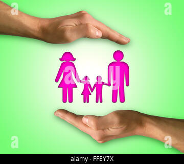 Two hands in position to protect family. Family life insurance Stock Photo