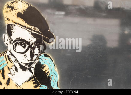 stencil graffito showing a nerdy young man with glasses Stock Photo