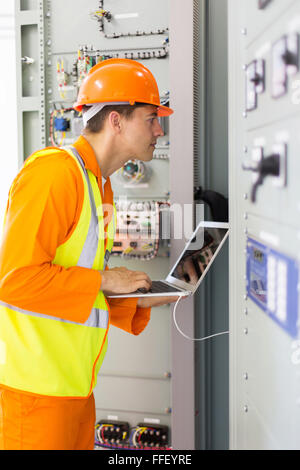 professional industrial technician checking transformer Stock Photo