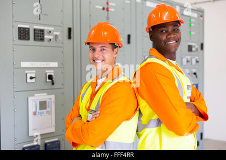 handsome young industrial engineers with arms crossed Stock Photo