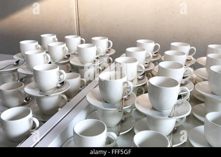Stacked saucers ready to serve guests Stock Photo