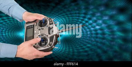 Flight remote controller in man's hands close up view on techno background Stock Photo