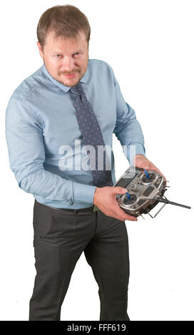Man with flight remote controller in hands close up view on white background isolated Stock Photo