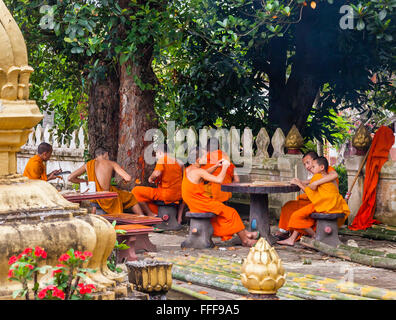 Lao People's Democratic Republic, Luang Prabang, novice buddhist monks at Wat Hosian Voravihane monastery Stock Photo