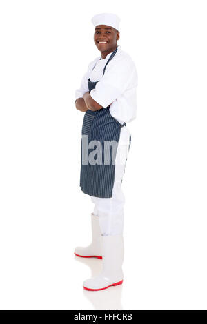 side view of successful young African chef looking at the camera Stock Photo