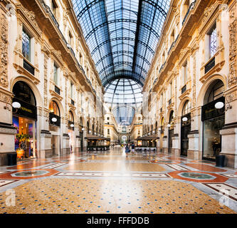MILAN, ITALY - AUGUST 29, 2015: Luxury Store in Galleria Vittorio Emanuele II shopping mall in Milan, tasted Italian restaurants Stock Photo