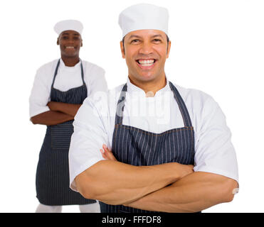 portrait of mid age chef with co-worker on background Stock Photo